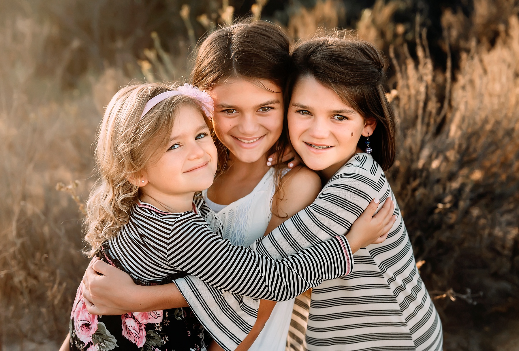 family photography carlsbad sisters hugging