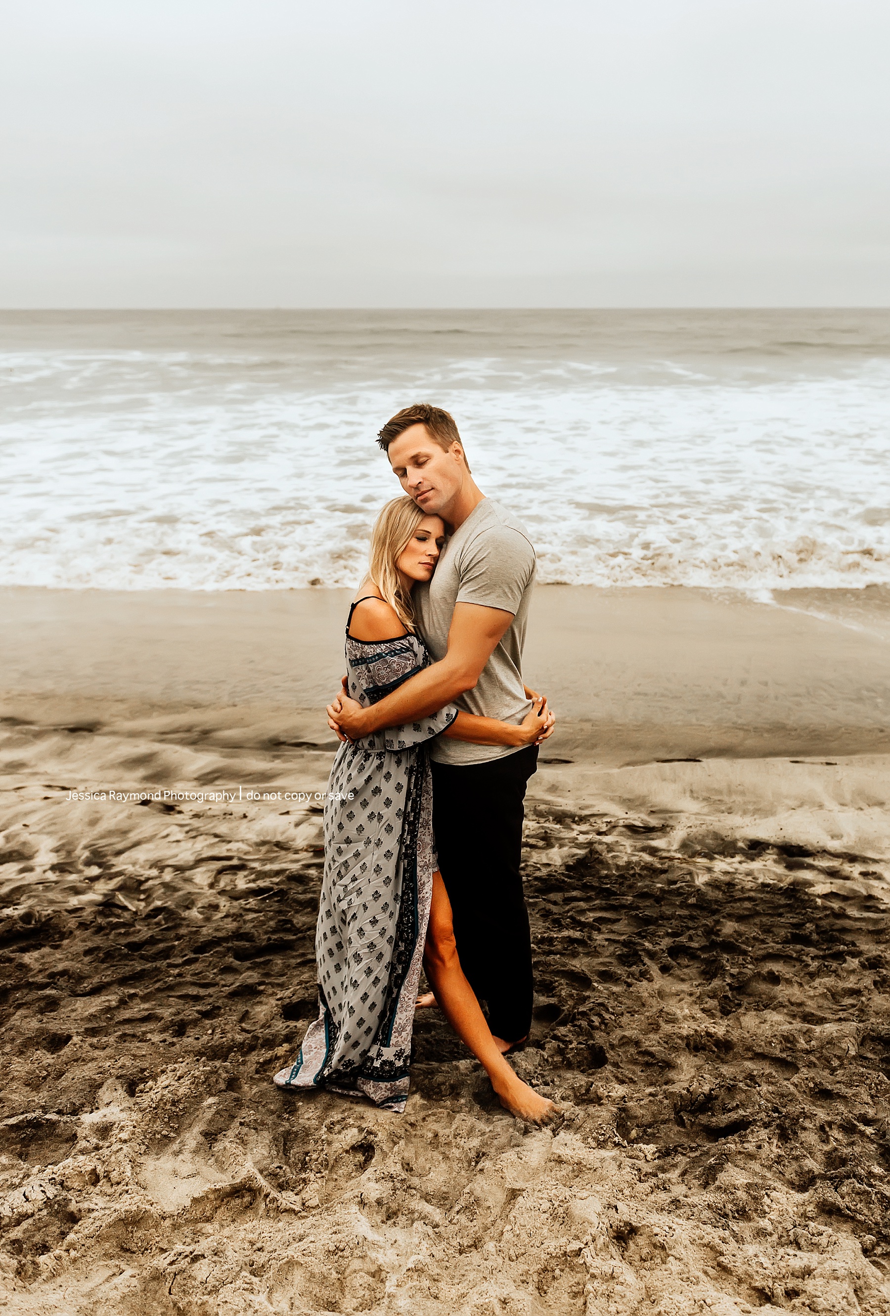 family beach pics couple pose hugging
