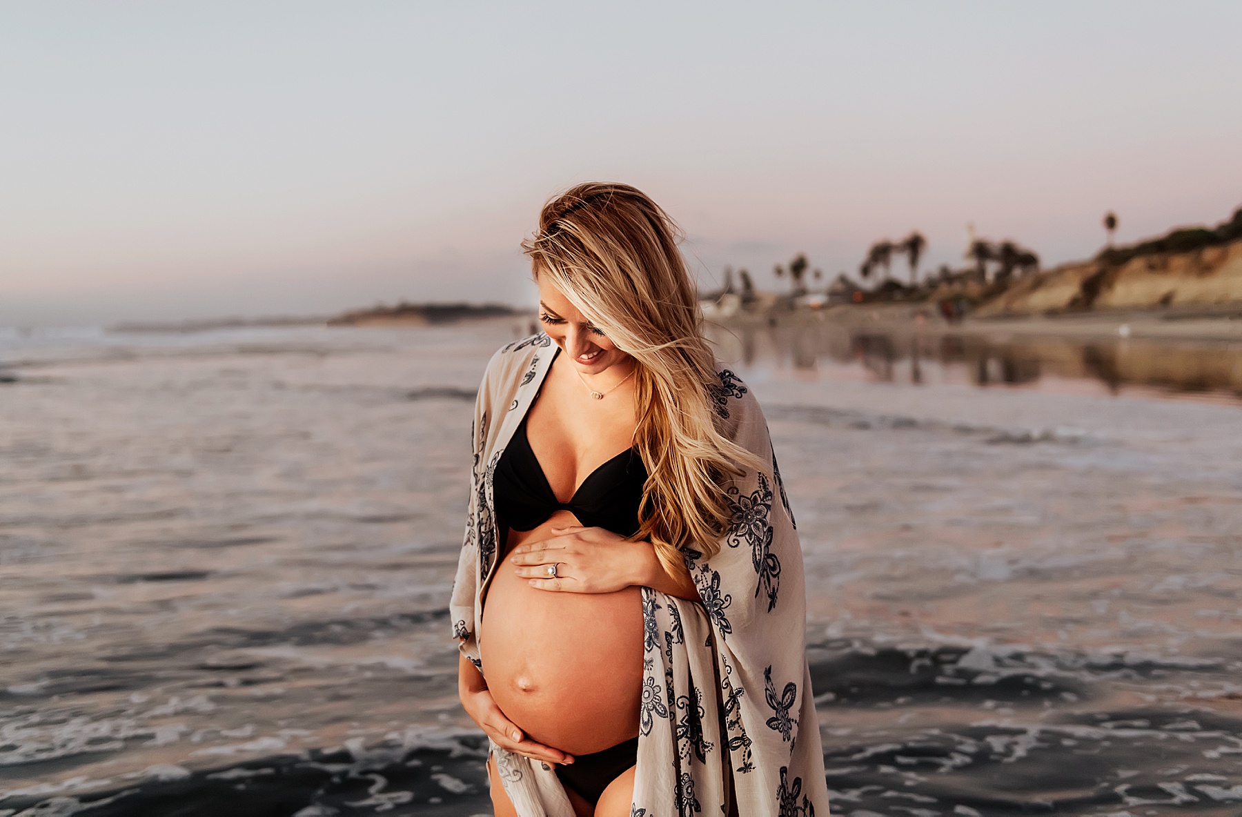 maternity photography pregnant mom on beach wearing bathing suit