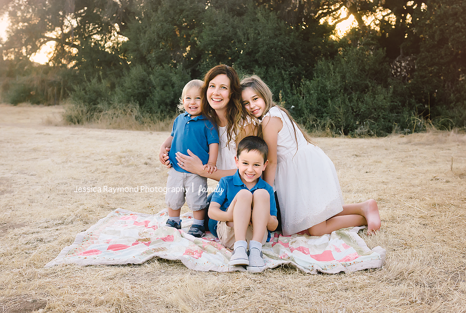 escondido family photographer family photos escondido photography mom with kids on blanket pose