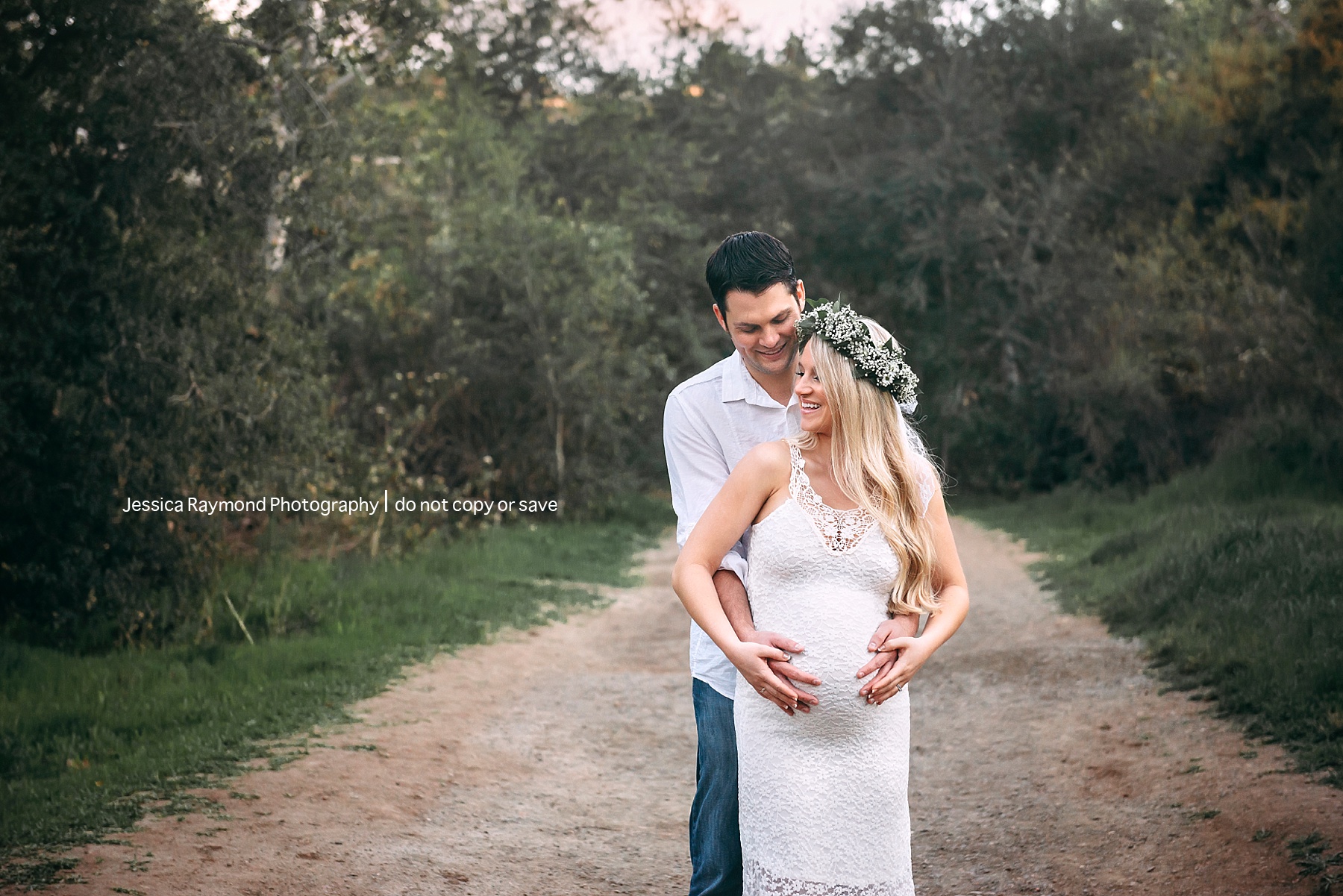maternity and newborn photographer in san diego couple in field