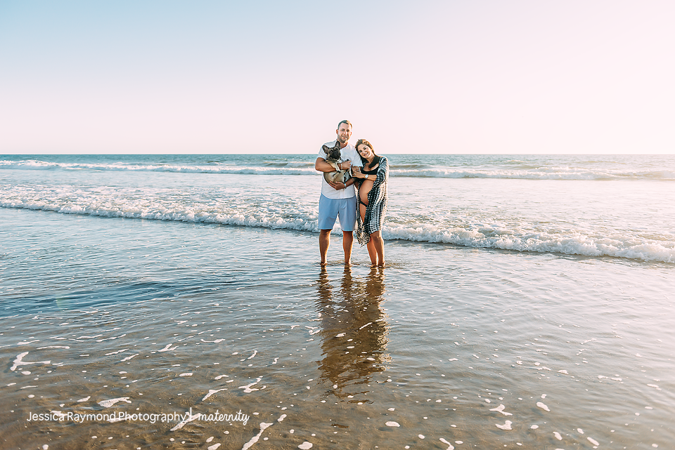 beach maternity photographer elegant couple pose with dog