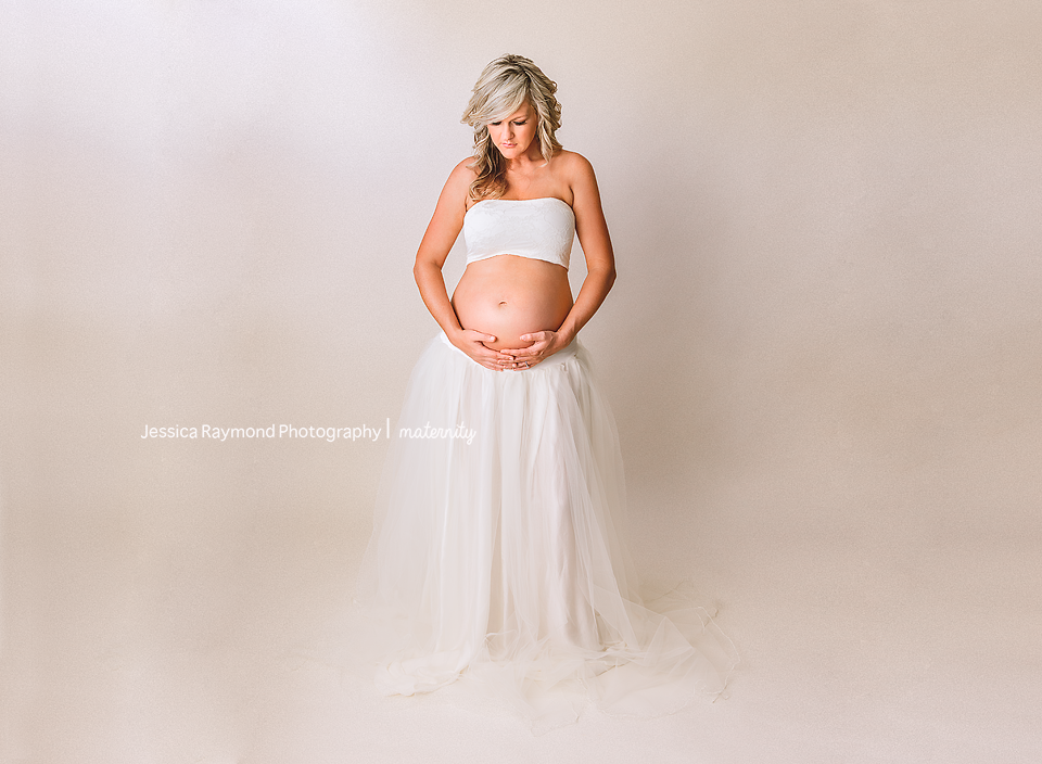 maternity photography in studio maternity photoshoot maternity session san diego california maternity pose in white sew trend maternity gown