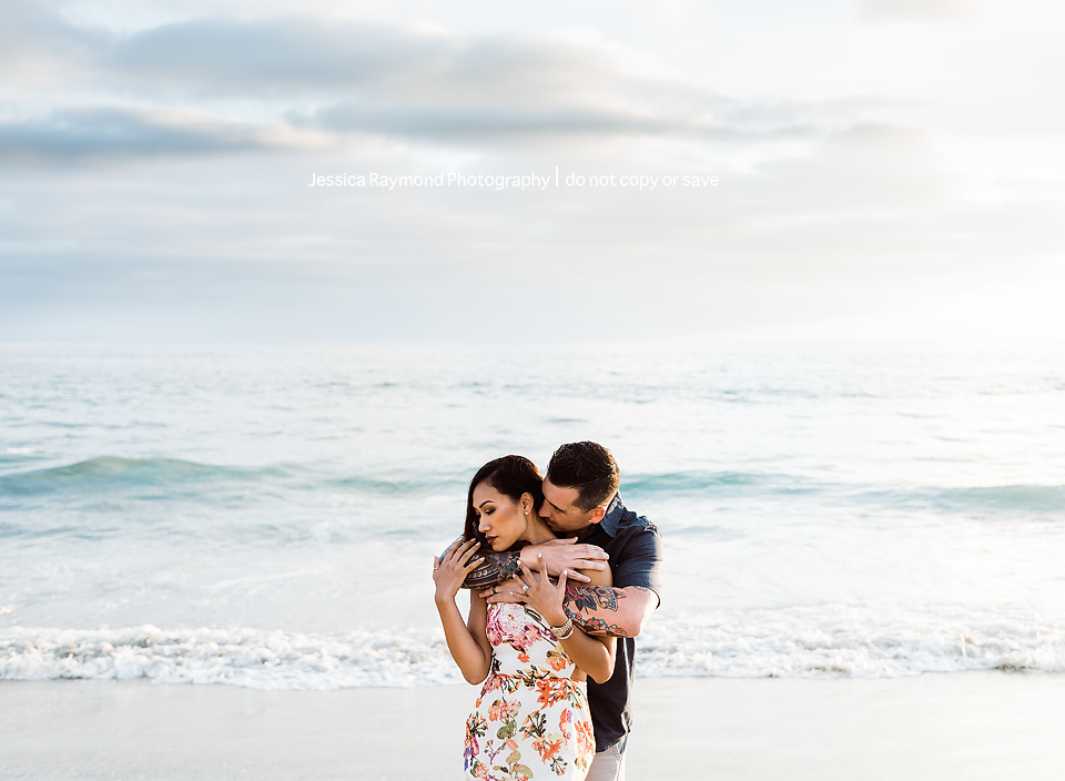 family photography oceanside family photographer couple pose at beach