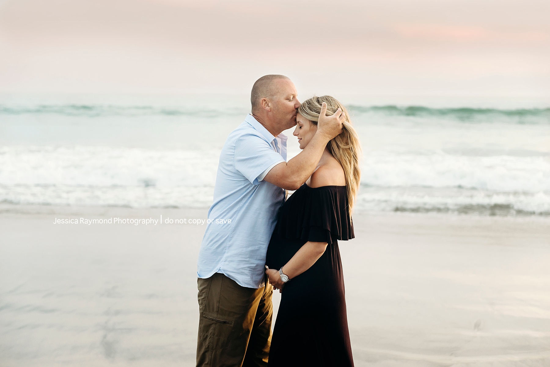 beach maternity pictures san diego couple pose