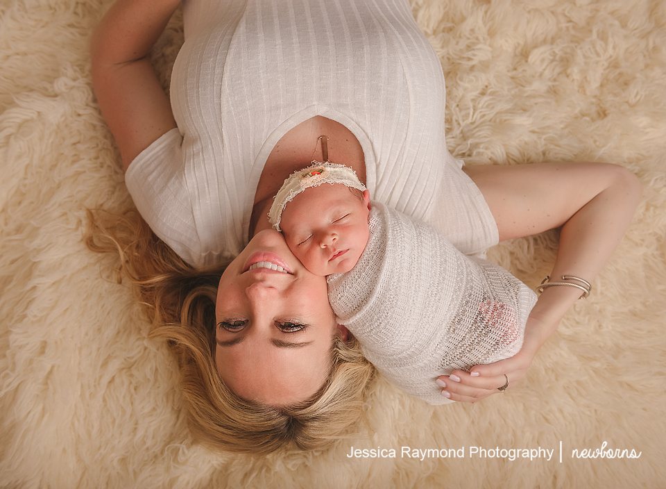 carlsbad baby photographer newborn family session newborn photo shoot baby girl in laying with mom
