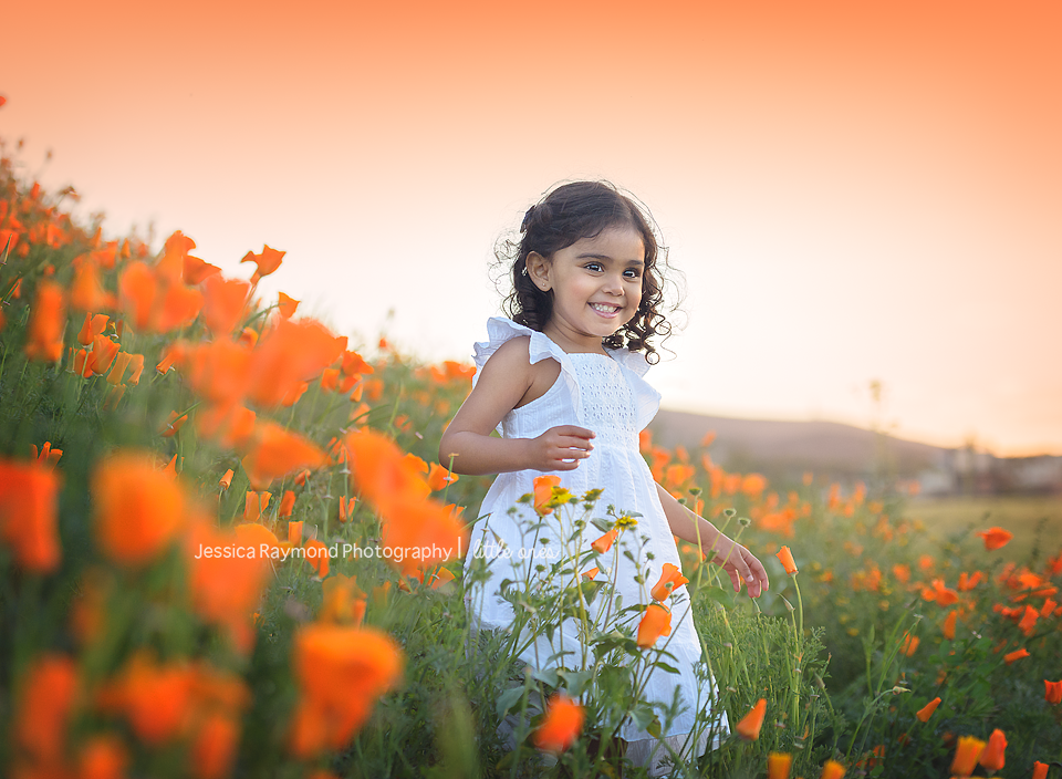 Child Photography Session Carlsbad Children's Photography Spring Portraits Girl In Flowers girl in white dress smiling