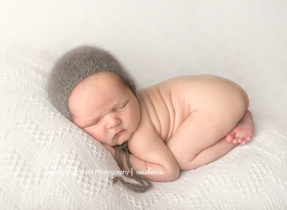 Newborn Photographer in San Diego newborn photography bum up pose white blanket