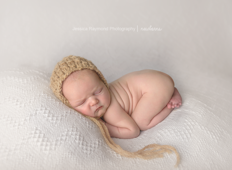 Newborn Photographer in San Diego newborn pictures bum up pose brown beanie