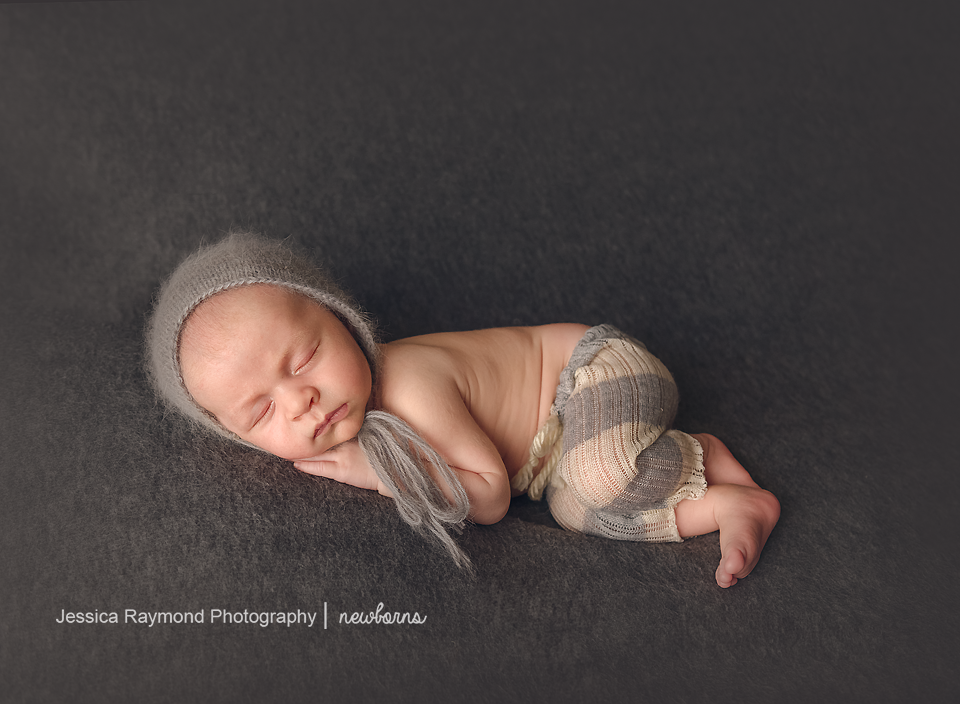 newborn photography studio session carlsbad california baby portraits baby boy laying on side